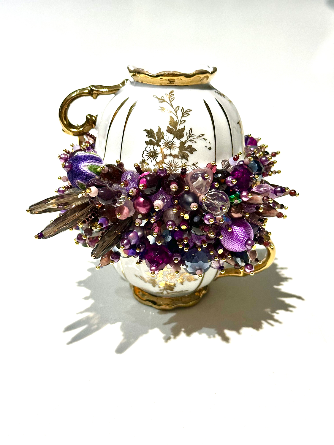 Two teacups on purple