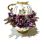 Two teacups on purple